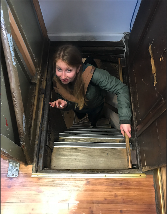 Climbing the narrow staircase to get to the top of the town hall in Rothenburg ob der Tauber, Germany